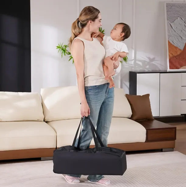 Pamo Babe portable crib with mattress and carrying bag. Choose from black, blue, or gray.